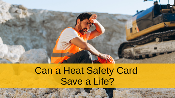Construction worker in an orange safety vest wiping sweat from his forehead beside an excavator at a hot worksite